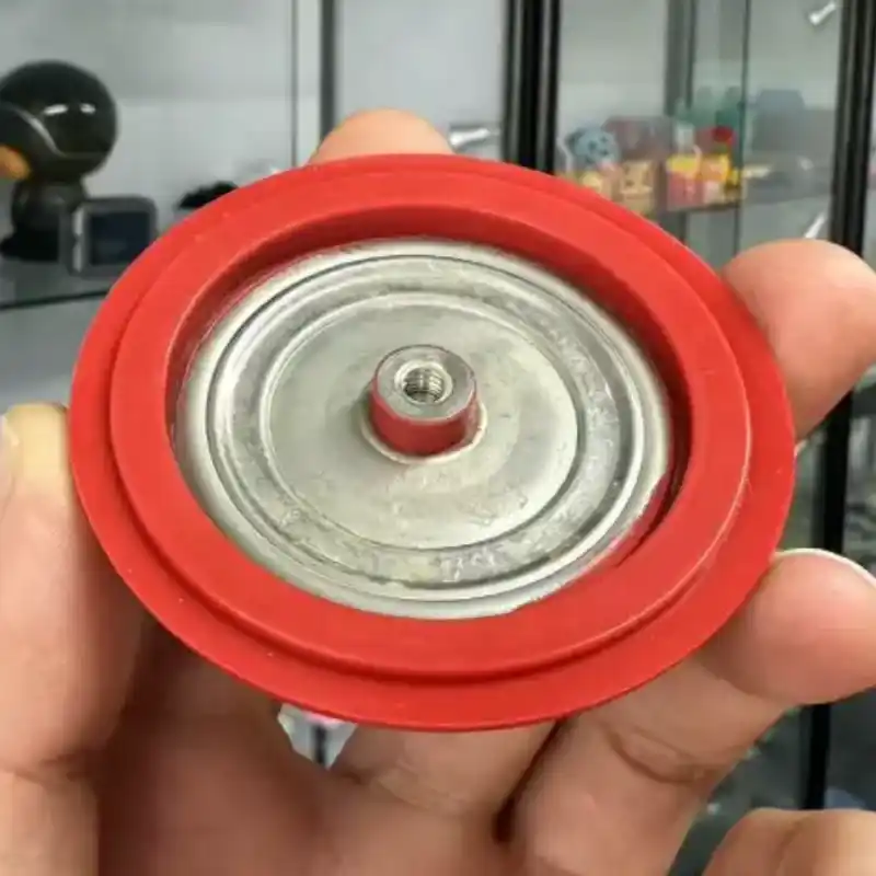Metal bonded silicone diaphragm with stainless steel insert
