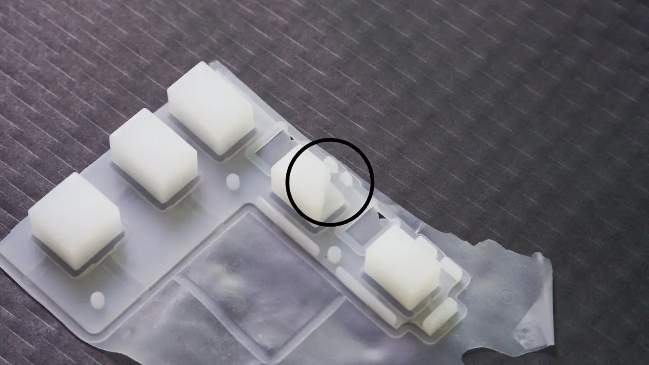Incomplete silicone keyboard part caused by low molding pressure