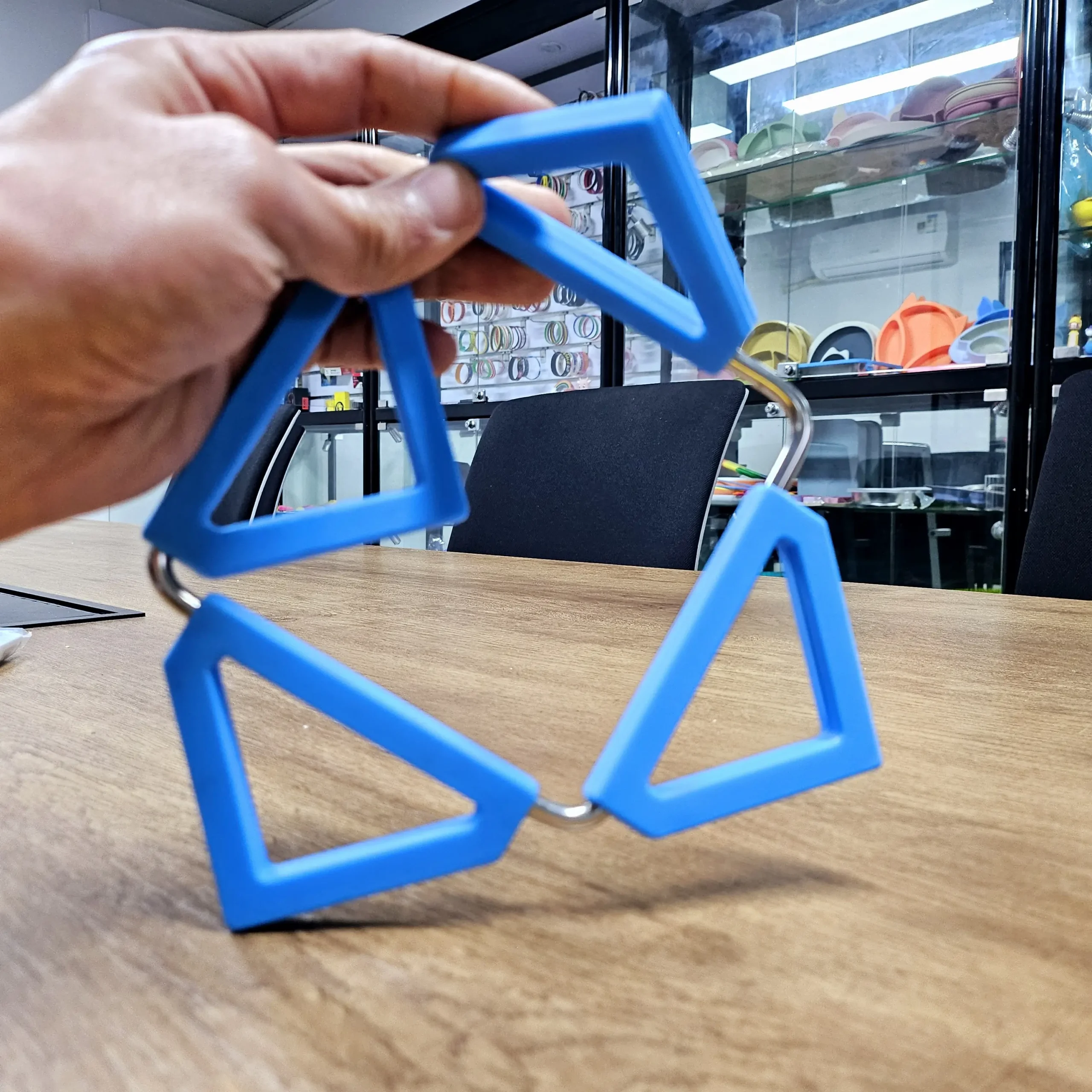 Blue silicone overmolded onto stainless steel wire frame for kitchen trivet