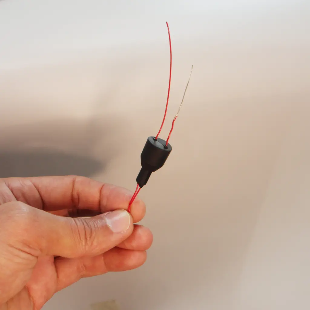 Silicone overmolded onto transistor for electronics protection