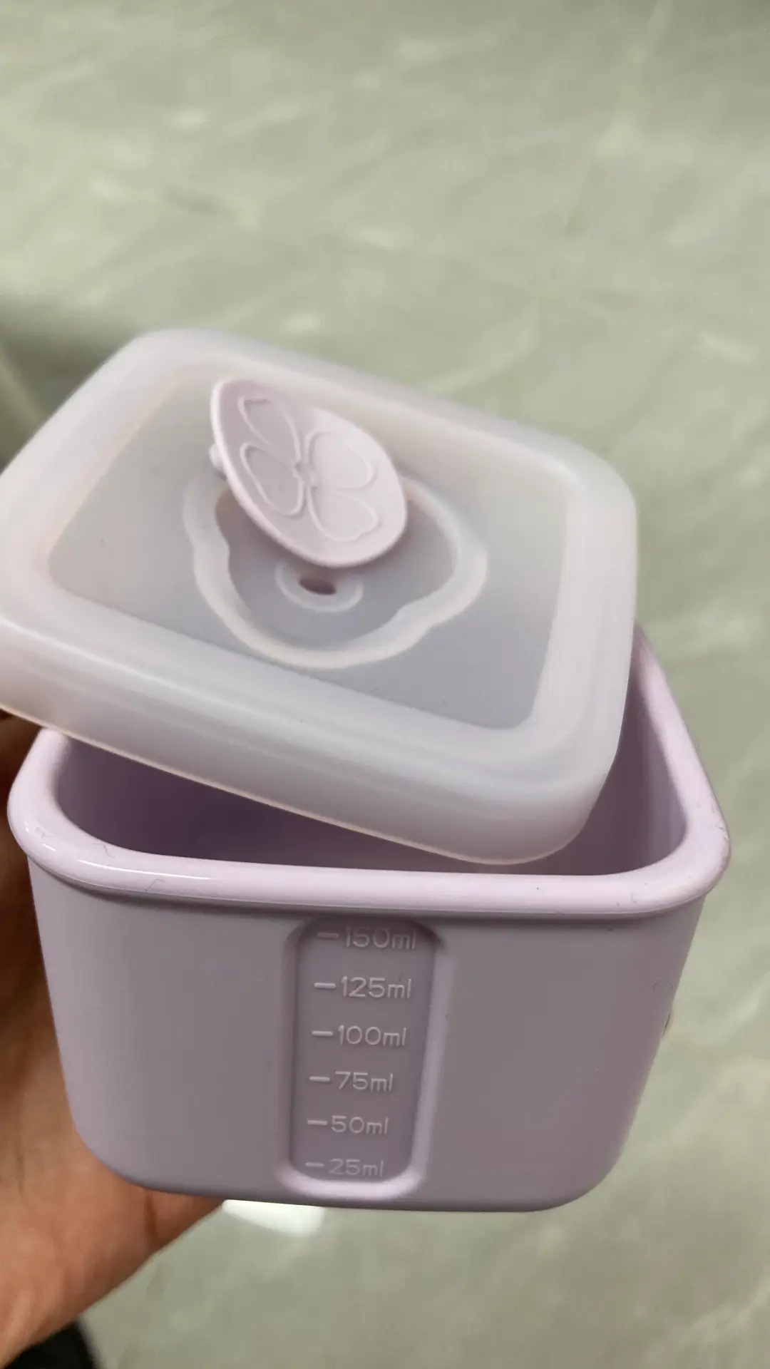 Custom silicone square container with removable lid, breathing valve, and engraved measurement markings in lavender