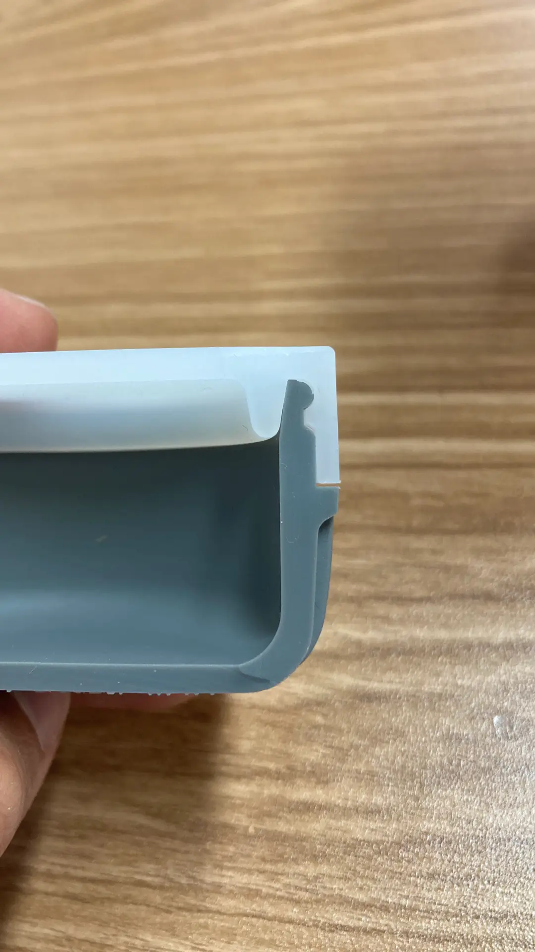 Custom silicone container with airtight sealing lid, showing seal mechanism, wall thickness, and opening tab detail