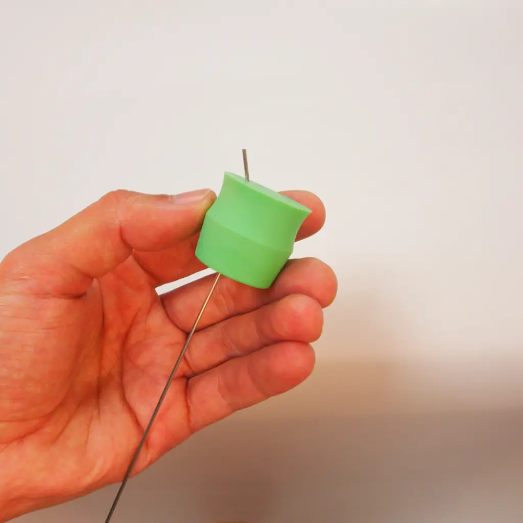Green silicone lab bung overmolded onto multiple stainless steel needle inserts