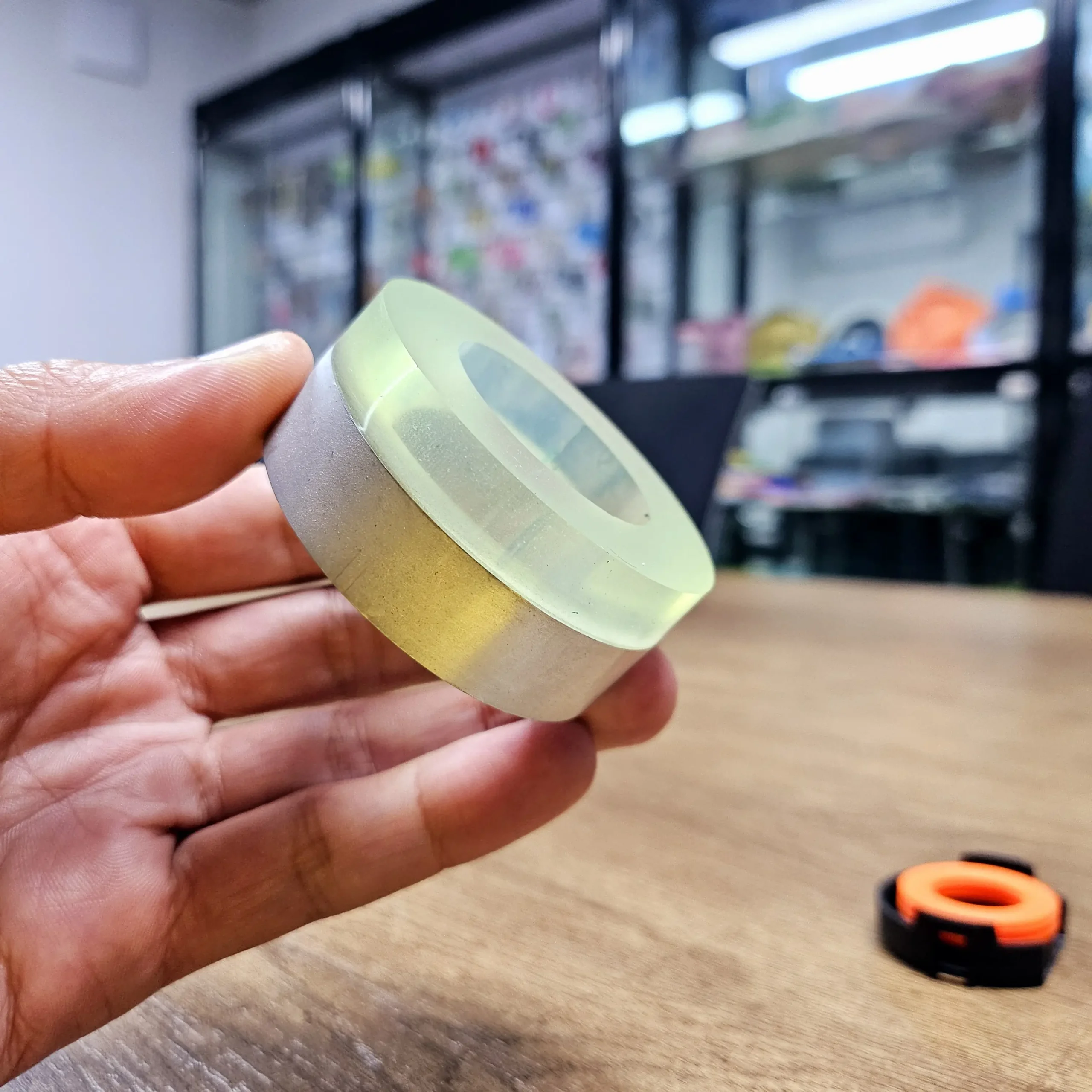Clear silicone overmolded onto aluminium cylindrical bushing insert